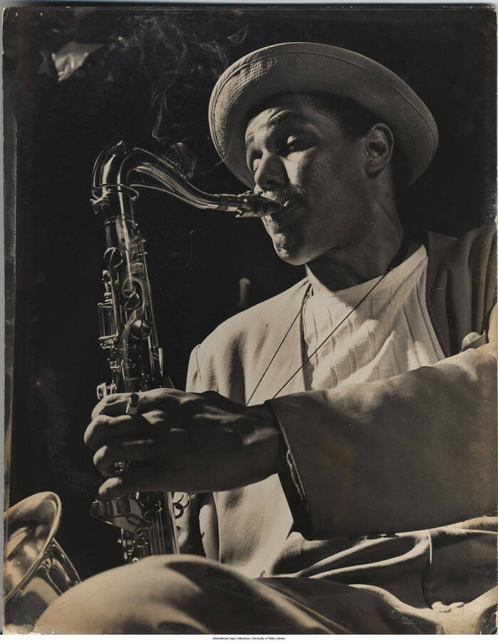 13 3/4 x 10 3/4 inch photograph; tenor saxophonist, Dexter Gordon, Royal Roost, NYC, 1948