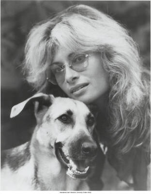10 x 8 inch photograph; Joanne Grauer with a dog
