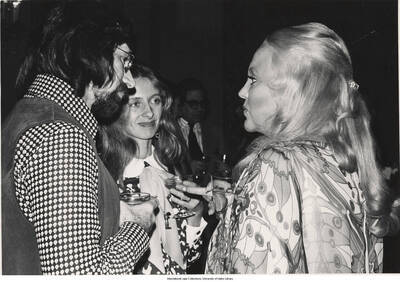 8 x 10 inch photograph; unidentified women and a man