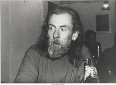 5 x 7 inch photograph; unidentified man in a restaurant