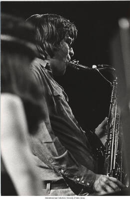 7 3/4 x 5 1/4 inch photograph; unidentified musicians performing