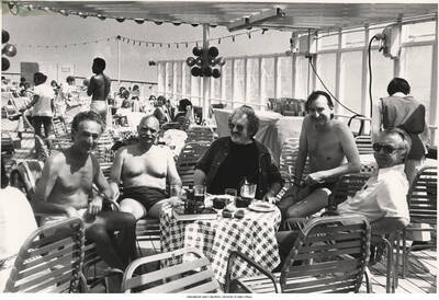 8 1/2 x 11 inch photograph; Leonard Feather and four unidentified men on board