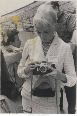 5 x 3 1/2 inch photograph; unidentified press photographer in a stadium