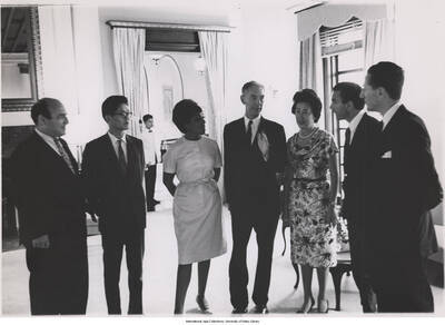 8 x 10 inch photograph; Leonard Feather and unidentified persons