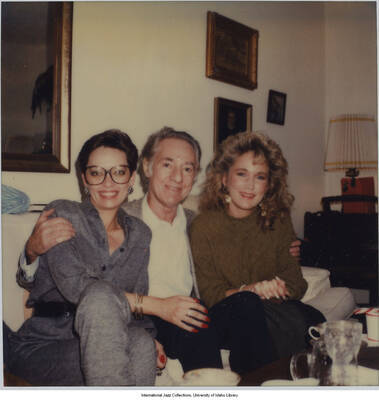 4 1/4 x 3 1/2 inch Polaroid photograph; Leonard Feather and friends celebrating a holiday in a home