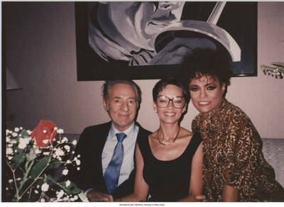 3 1/2 x 5 inch photograph; Leonard Feather with two unidentified women