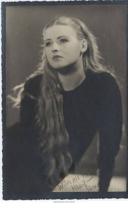 7 1/4 x 4 3/4 inch signed photograph; a woman. The photograph is dedicated to Leonard Feather from Sande