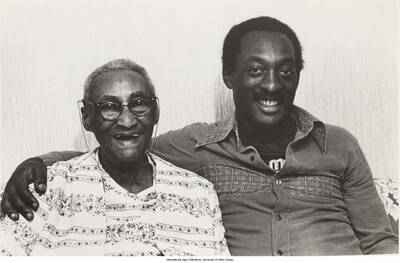 8 x 10 inch photograph; Percussionist Ralph McDonald sitting with his grandmother