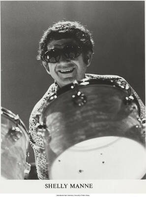 10 x 8 inch photograph; Shelly Manne playing the drums