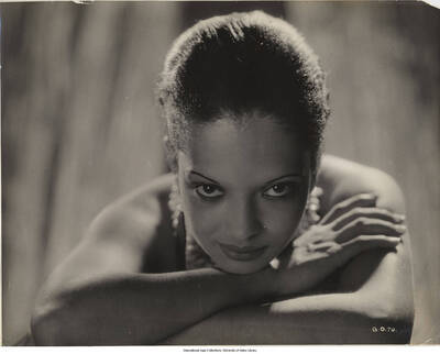 7 1/2 x 9 1/2 inch photograph; Nina Mae McKinney. Handwritten on the back of the photograph: Nina Mae McKinney, who sings in BBC The Voice of Britain, recently released