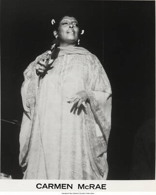 10 x 8 inch photograph; Carmen McRae. Label on the back of the photograph reads: Inimitable jazz vocalist Carmen McRae will perform at UCLA's Royce Hall, Friday, April 2, at 8:30 p.m. (1 duplicate)