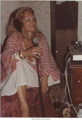 5 x 3 1/2 inch photograph; Marilyn Moore. Handwritten on the back of the photograph: Marilyn Moore; Radio emission show, Paris, France; 1981-07