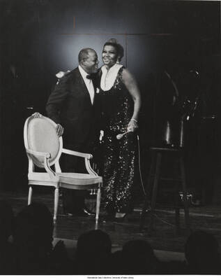 10 x 8 inch photograph; Pearl Bailey and Louis Armstrong on stage