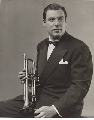 10 x 8 inch photograph; Bobby Burnet posing with his trumpet