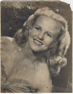 14 x 11 inch photograph; portrait of vocalist-composer Peggy Lee.