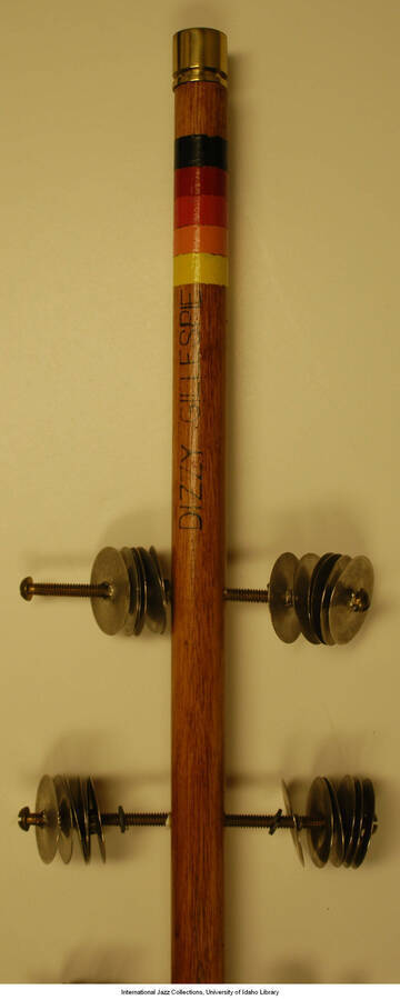A four foot long rhythm stick inscribed with the name "Dizzy" on the haft.