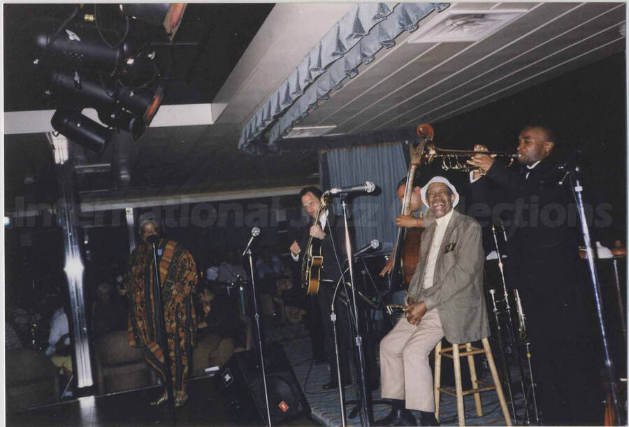 Al Grey with unidentified musicians on a stage