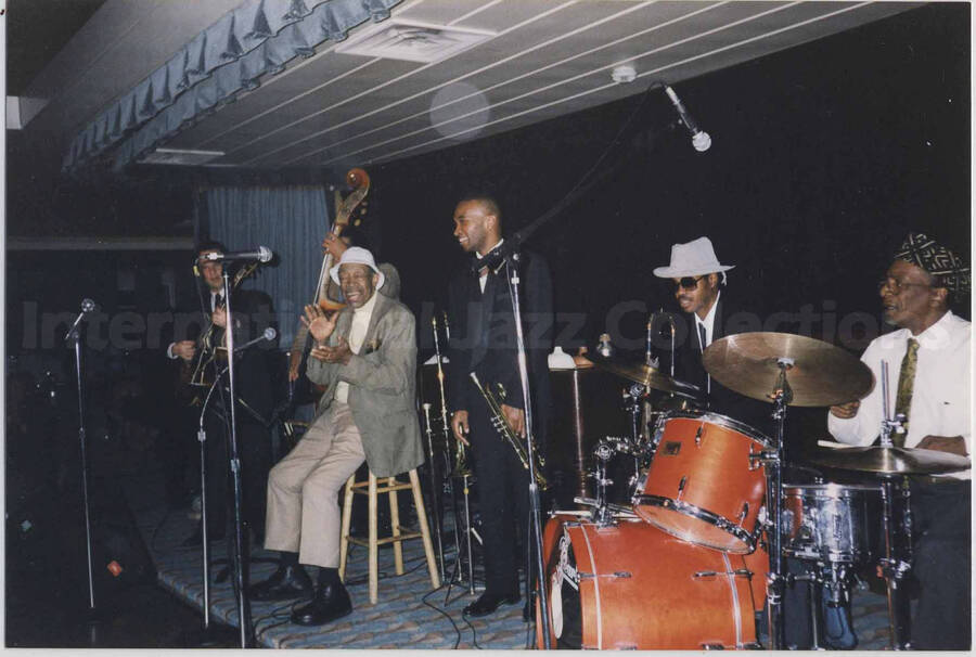 Al Grey with unidentified musicians on a stage