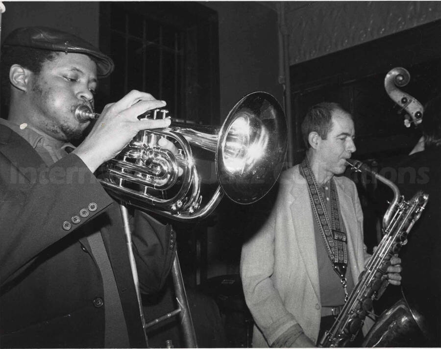 Two unidentified musicians, one a trumpeter and the other a saxophonist