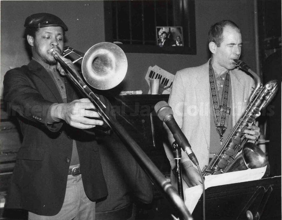 Two unidentified musicians, one a trumpeter and the other a saxophonist