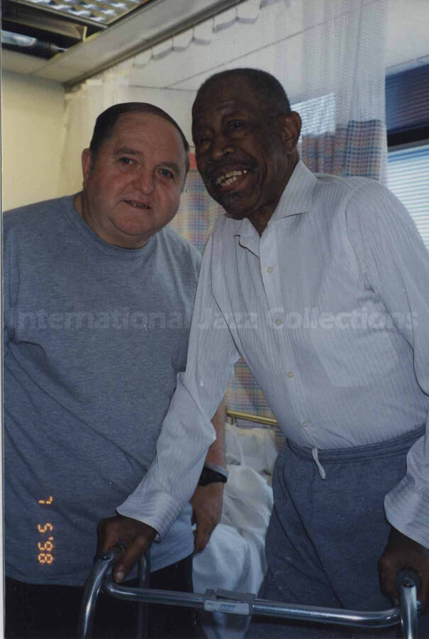 Al Grey and a man appearing to be in a hospital room. The photograph is dedicated to Al Grey from his friend and roommate Fred