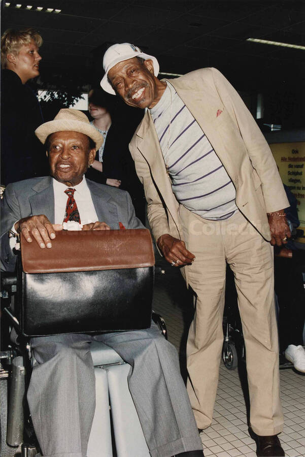 Lionel Hampton and Al Grey. A label on the back of the photograph reads: Monday 1994-07-11. 19th North Sea Jazz Festival/The Hague [Golden Men of Jazz]; Amsterdam Airport [Departure hall] "Schiphol"