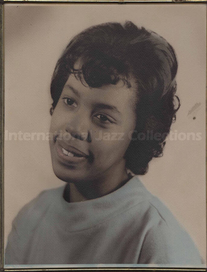 Portrait of an unidentified woman. The photograph is in a metal desk frame. No inscriptions on the back of the photograph