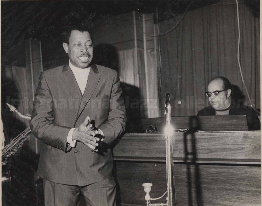 Al Grey and an unidentified pianist. This photograph is pasted on a photo album
