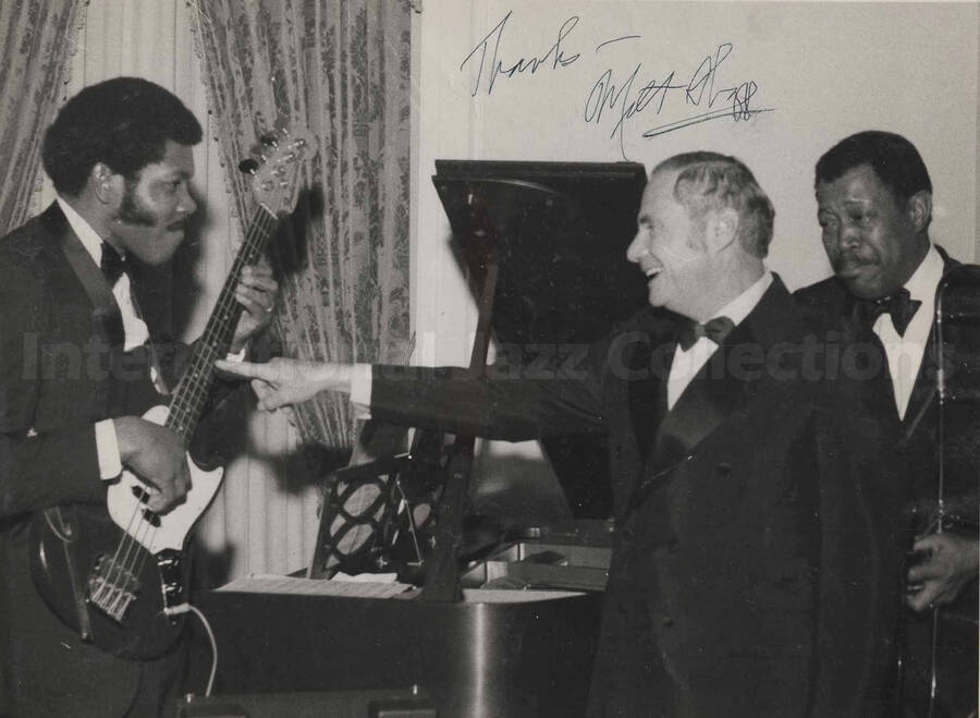 Al Grey and band at Governor Milton Shapp's inaugural party at the Governor's Mansion in Harrisburg, PA. The photograph is signed by Governor Milton Shapp. This photograph is pasted on a photo album