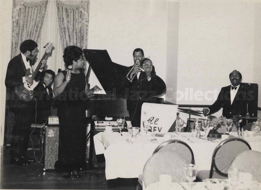 Al Grey and band performing at Governor Milton Shapp's inaugural party at the Governor's Mansion in Harrisburg, PA. This photograph is pasted on a photo album