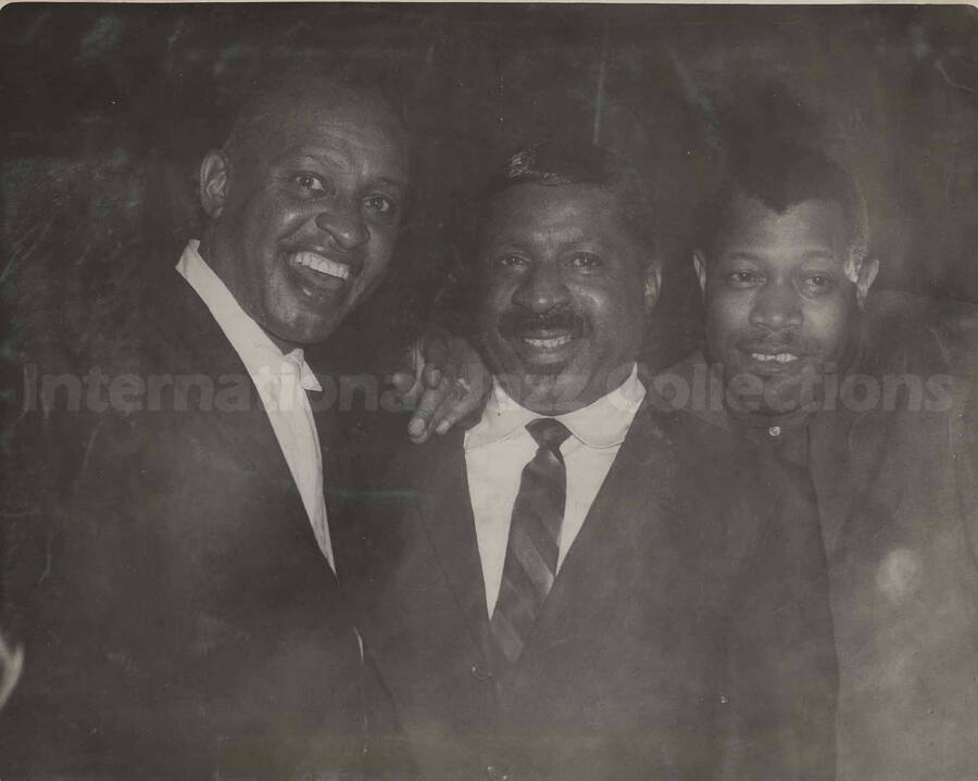 Lionel Hampton, Erroll Garner, and Al Grey. This photograph is pasted on a photo album