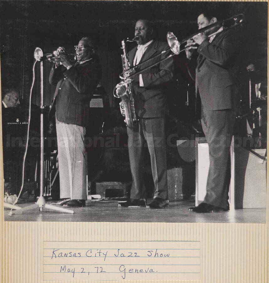 Al Grey performing with an unidentified orchestra. A label below the photograph reads: Kansas City Jazz Show, May 2, 72, Geneva. This photograph is pasted on a photo album