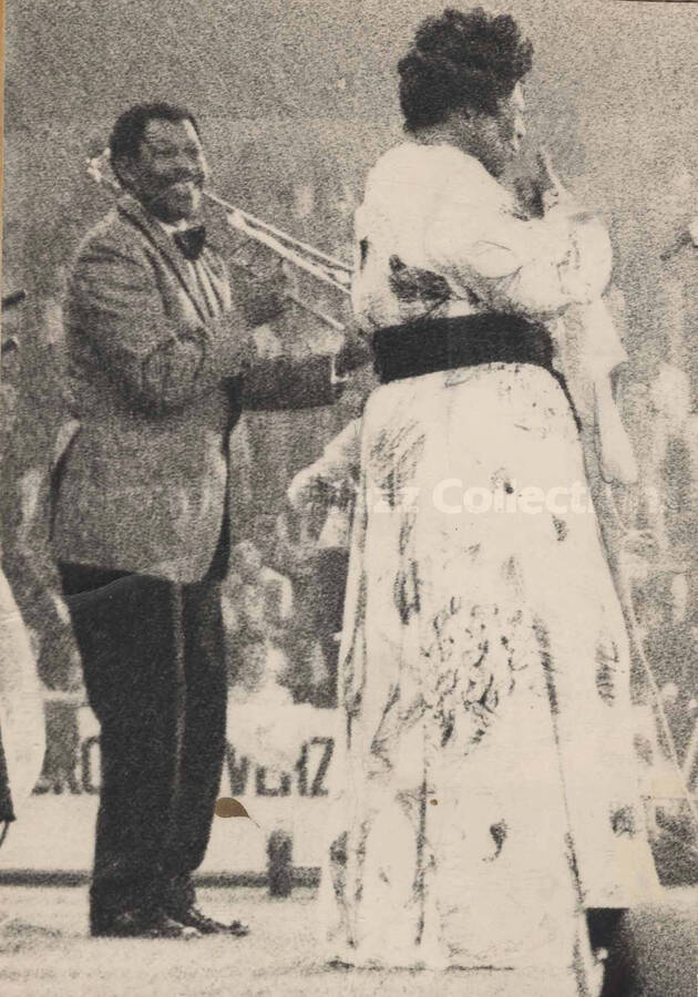 Al Grey performing with Ella Fitzgerald, in Holland. This photograph is pasted on a photo album