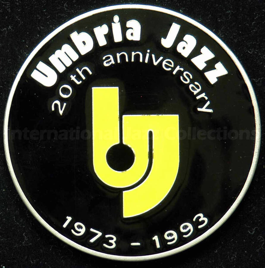 Medal. The obverse side of the medal includes the inscription: Umbria Jazz 20th anniversary, 1973-1993. The reverse: Associazione Umbria Jazz. The medal is inside a blue presentation box. A label on the inside of the box lid reads: Gioielleria Coppe Trofei Chioccoloni, Perugia [Italy]