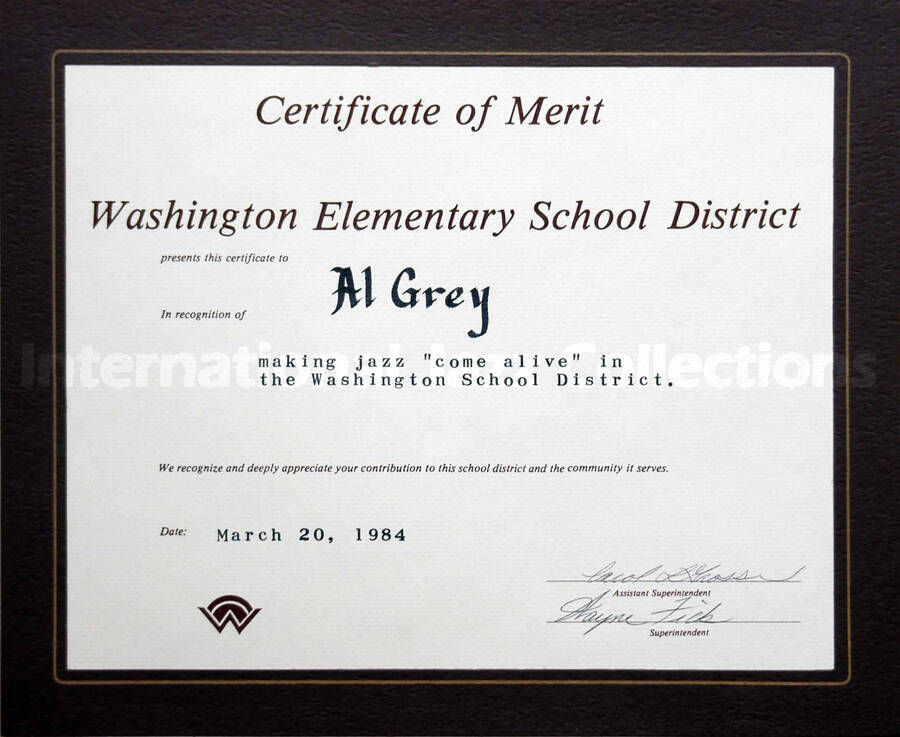Certificate. To Al Grey from the Washington Elementary School District. The certificate is in a brown folder