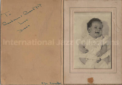 Al Grey's great-niece. The photograph is in a paper frame dedicated to Grand mom and Grand pop by Diane, age 3 months
