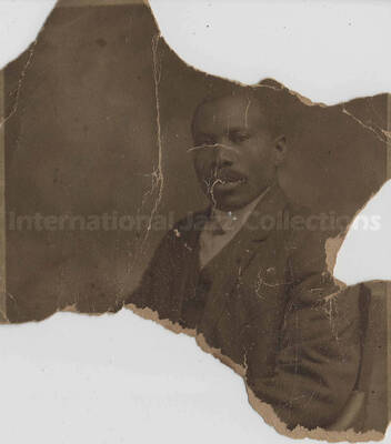 Portrait of an unidentified man.  This photograph is missing segments