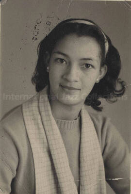 A woman. Handwritten on the back of the photograph: Madie P. Whitney, dress making