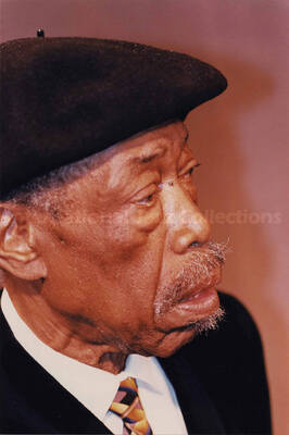 Al Grey. The photograph is pasted on a white cardboard. Handwritten on the cardboard bellow the photograph: Bill Kreisberg, 1997.