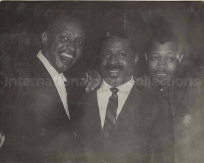 Lionel Hampton, Erroll Garner, and Al Grey. This photograph is pasted on a photo album