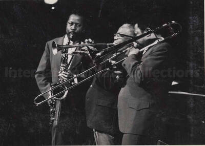 Al Grey (right) performing with saxophonist Eddie 'Lockjaw' Davis and trumpet player Roy Eldridge. This photograph is pasted on a photo album