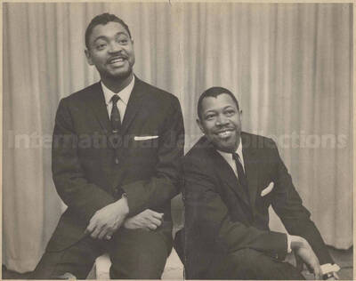 Al Grey with an unidentified man. This photograph is pasted on a photo album