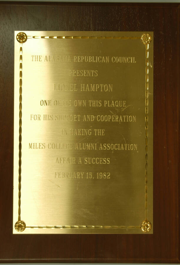 Plaque. 10 1/2"x8" Wood finish plaque with gold engraved plate To Lionel Hampton from the Alabama Republican Council for his support and cooperation in making the Miles College Alumni Association Affair a success.  Feb. 15, 1982