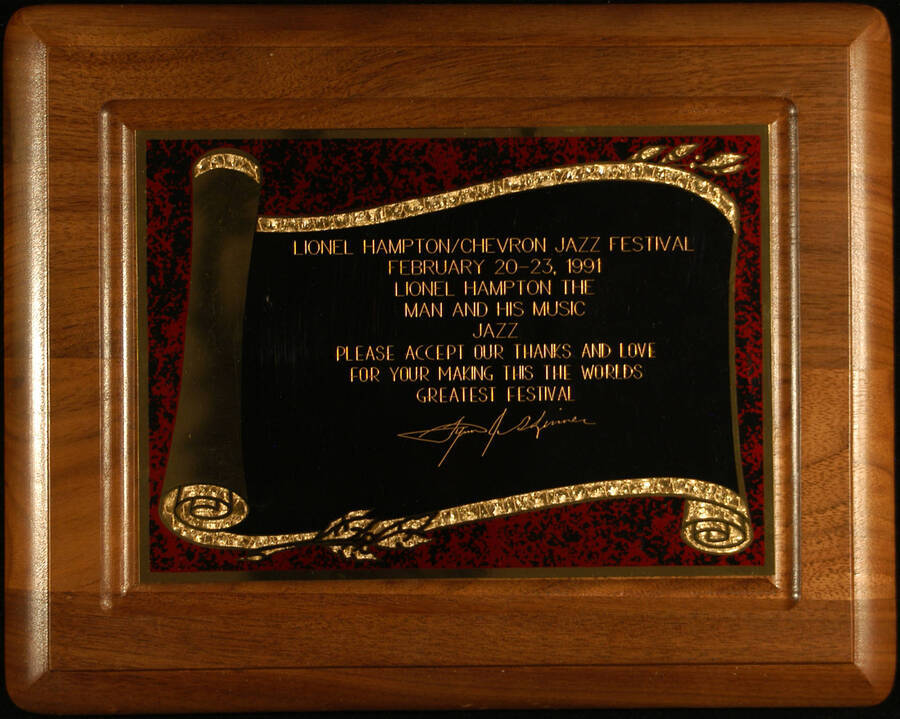 Plaque. 8"x10" Wood finish plaque with red marbleized border engraved plate To Lionel Hampton from Lynn Skinner, for making the University of Idaho Lionel Hampton/Chevron Jazz Festival, the world's greatest festival. Feb. 20-23, 1991