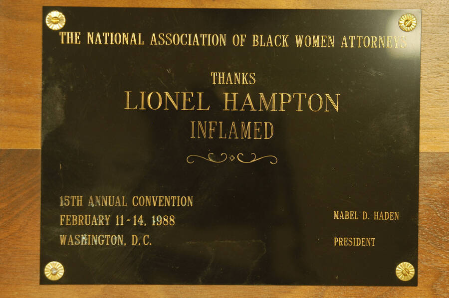 Plaque. 8"x10" Wood finish plaque with black engraved plate To Lionel Hampton from the National Association of Black Women Attorneys on the occasion of the 15th Annual Convention. Mabel D. Haden, President. Washington, D.C., Feb. 11-14, 1988