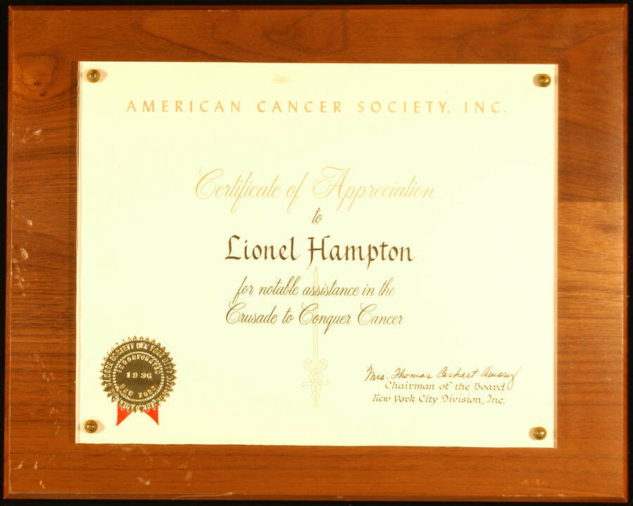 Certificate Plaque. 8"x10" Certificate with gold foil seal, mounted under acrylic on a 10 1/2"x13" wood plaque Certificate of Appreciation presented to Lionel Hampton by the American Cancer Society for notable assistance in the Crusade to Conquer Cancer. Mrs. Thomas Carhart Amory, Chairman of the Board, New York City Division.