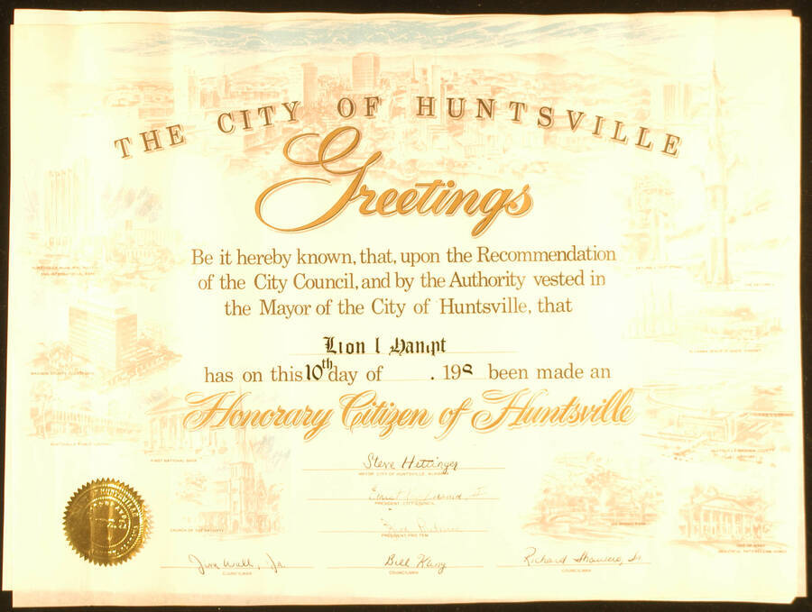 Certificate. 13"x17 1/2" Certificate with gold foil Seal of the City of Huntsville. Also a piece of light blue ribbon that tied the certificate Title of Honorary Citizen of Huntsville presented to Lionel Hampton. Steve Hettinger, Mayor and members of the City Council. Huntsville, AL, 1988