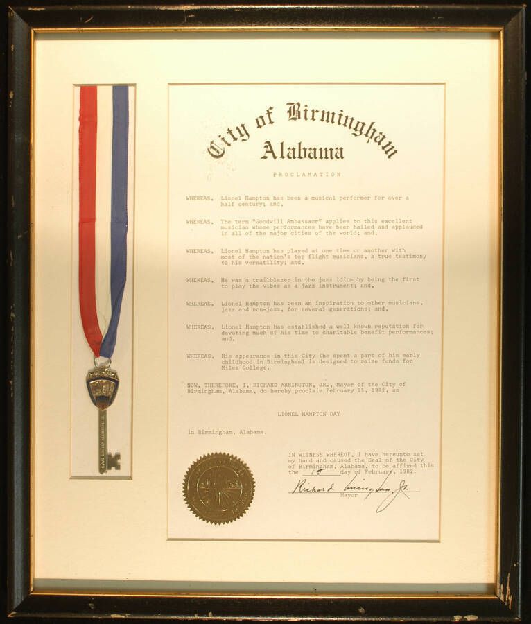 Framed Certificate and Key to the city. 17 1/2"x14 3/4" Frame holding a 13"x8" certificate with gold foil Seal of the City of Birmington and 3" ceremonial key tied to a red, blue and white ribbon on white mat under glass City of Birmingham proclaims February 15, 1982 as Lionel Hampton Day on the occasion of his appearance in the city designed to raise funds for Miles College. Richard Arrington, Jr., Mayor. Birmingham, AL, Feb. 1st, 1982