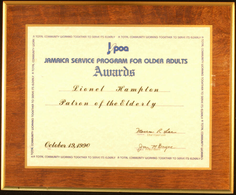 Certificate Plaque. 8 1/2"x11" Certificate laminated on a 11 1/2"x14" wood plaque Title of Patron of the Elderly presented to Lionel Hampton by Jamaica Service Program for Older Adults. New York, Oct. 19, 1990