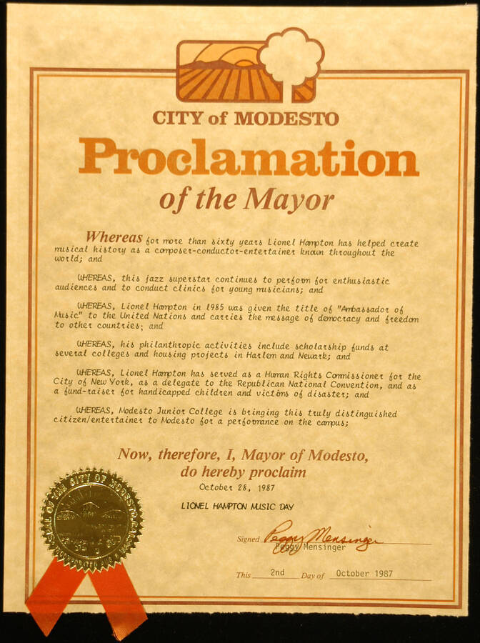 Certificate. 10 3/4"x8 1/4" Proclamation with gold foil Seal of the City of Modesto and orange ribbon in 16"x12" double mat City of Modesto proclaims October 28, 1987 as Lionel Hampton Music Day, on the occasion of his performance at Modesto Junior College. Peggy Mensinger, Mayor. Modesto, CA Oct. 2, 1987